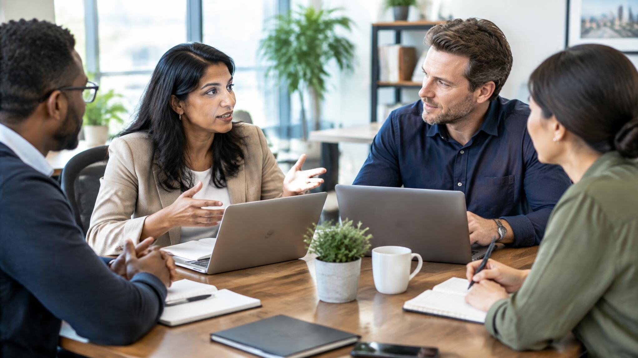 Group of executives in a leadership discussion around a table